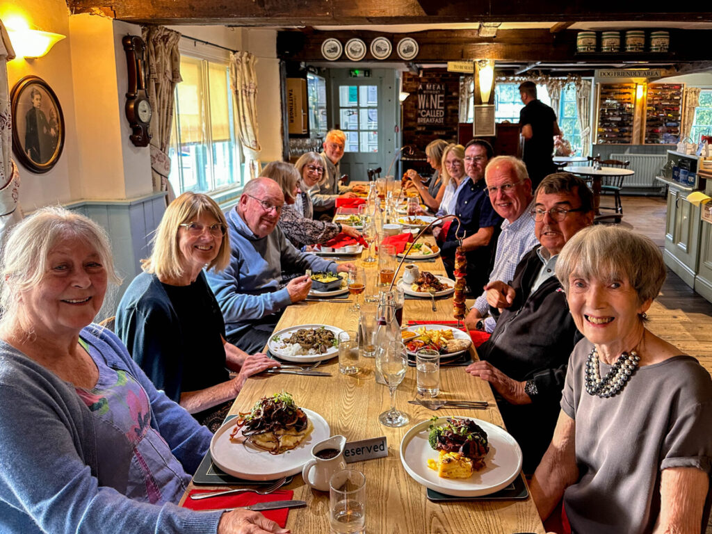 Evening diners at local restaurant sat at long table
