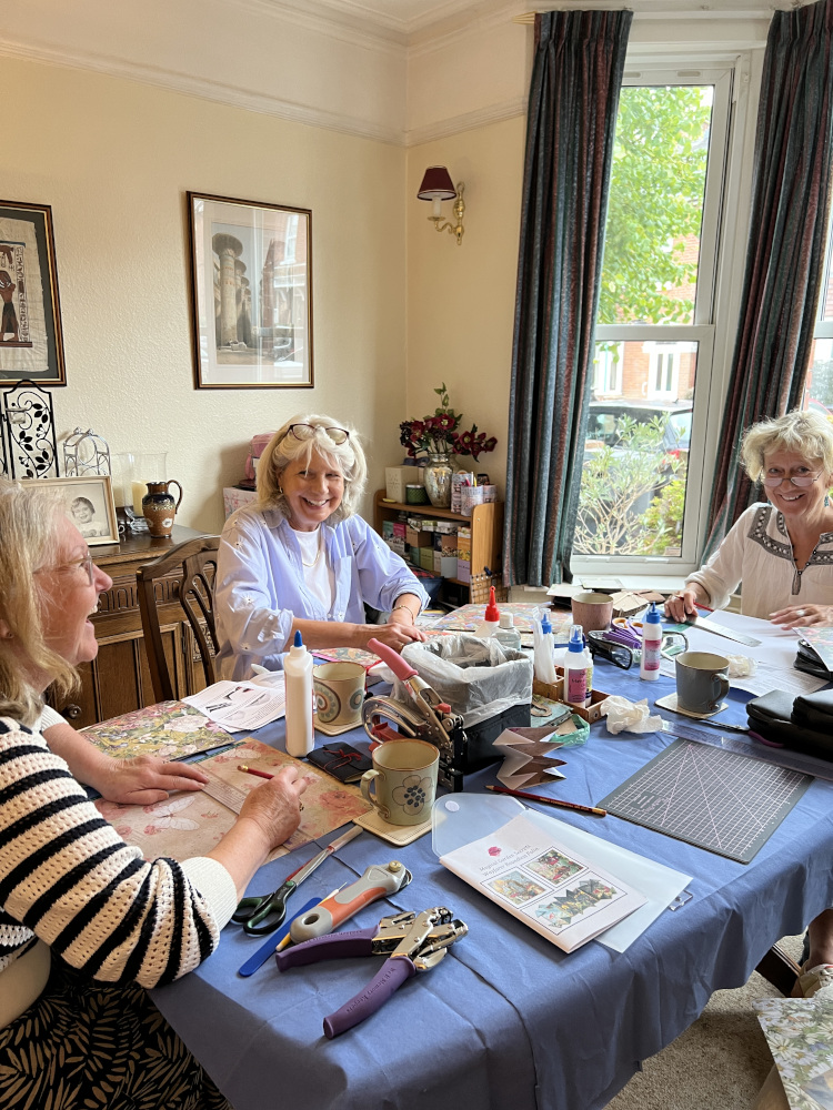 Creative Craft Group at work around a table.